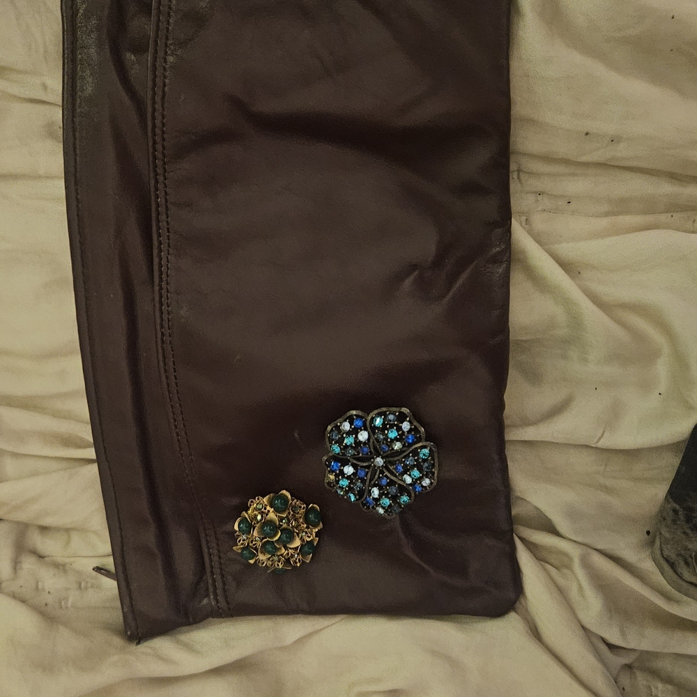 Elegant Brown Clutch with Decorative Accents